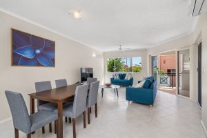 dining setting and lounge room of 3 bedroom apartment at North Cove Cairns